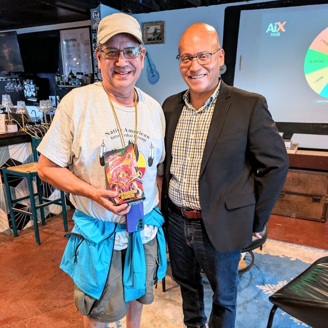 AI Exchange attendee with raffle prize in front of the presentation screen